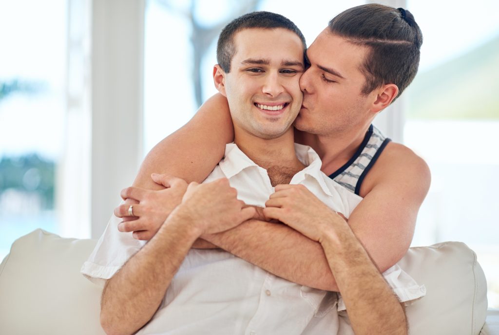 Two young attractive men in a sexual embrace. Pump Up Your Male Sexual Energy With Weight Training