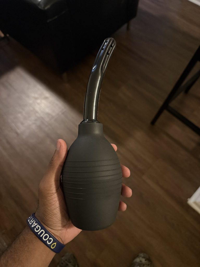 Close up of a douche to clean inside the anus before receiving prostate massage